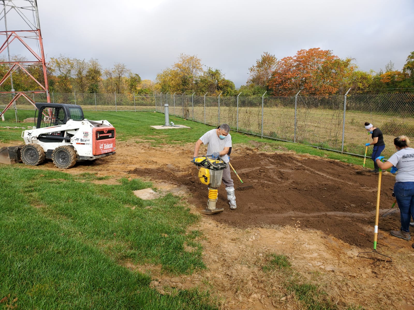 Sandow Construction staffs dig through the area