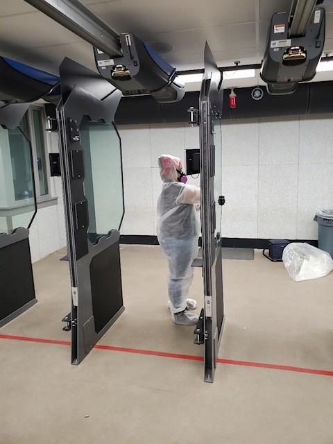 Cleaners cleaning the autoamted door.